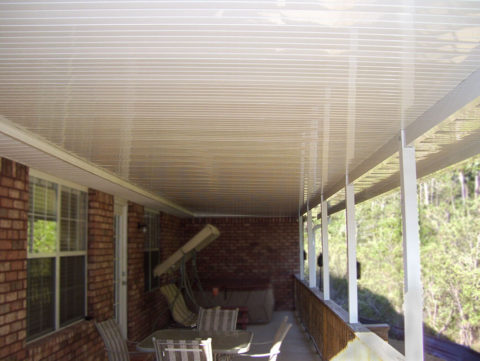 Patio cover with riser pan roof