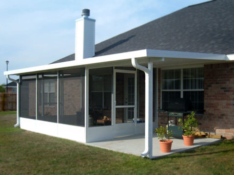 Screen room consisting of patio cover extension over concrete patio